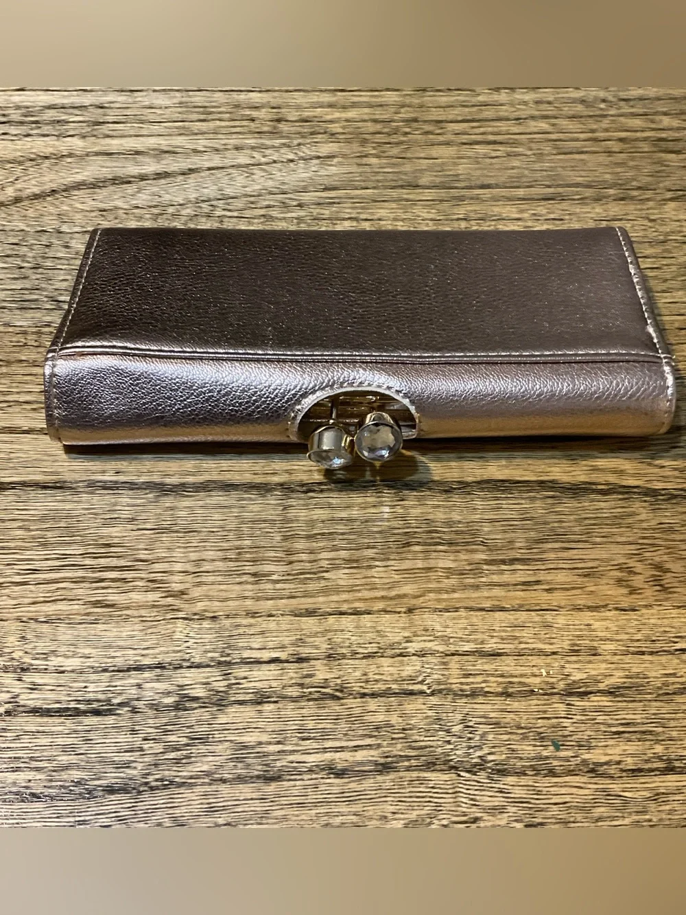 Metallic rose gold wallet with faux diamond clasp, EUC